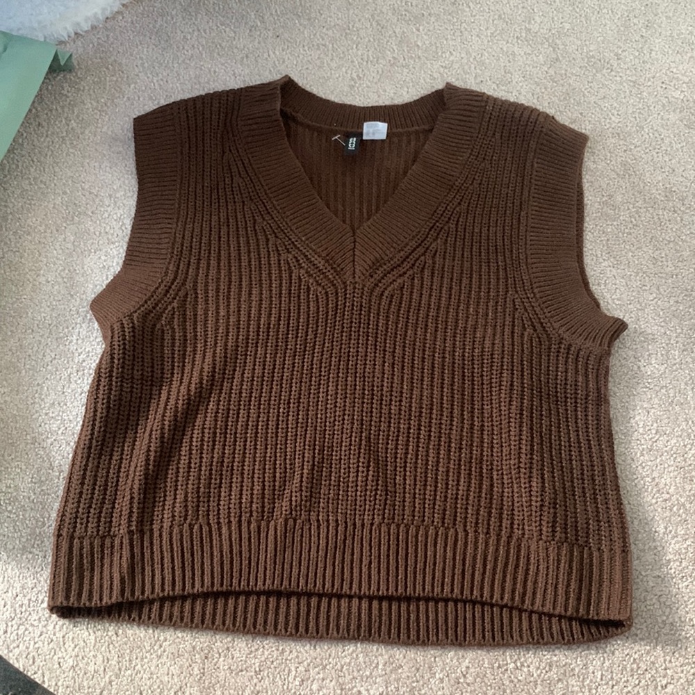 This is a brown knit vest never used